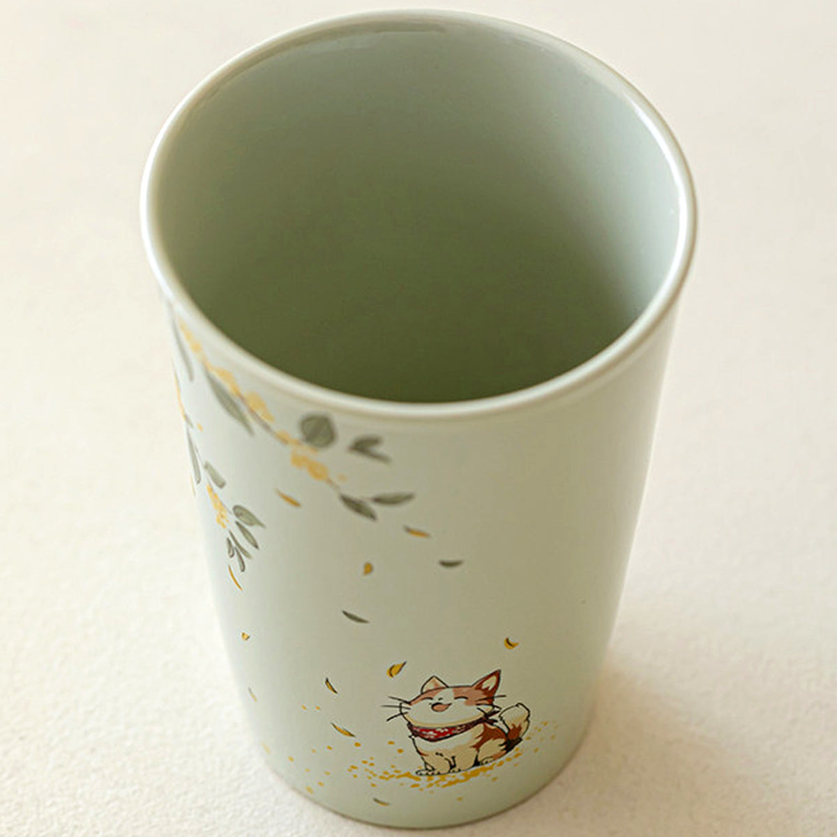 Handcrafted plant ash glaze ceramic mug with hand-painted cat and osmanthus design, gallery view 2