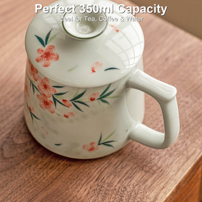 Hand-painted peach blossom ceramic mug with ceramic lid and tea strainer, gallery view 1