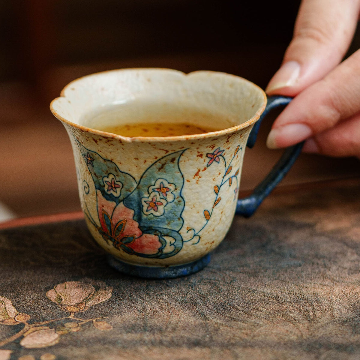 Hand-painted gold-traced butterfly tea cup with heart-shaped handle, gallery view 3
