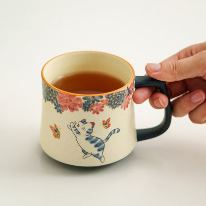 Mineral white tea infuser mug with hand-decorated butterfly and cat art, gallery view 5