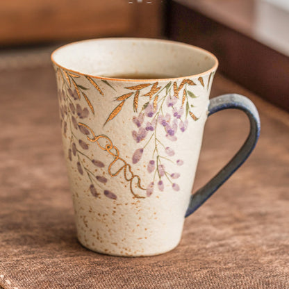 Hand-painted blue-fire wisteria ceramic mug with gold trim