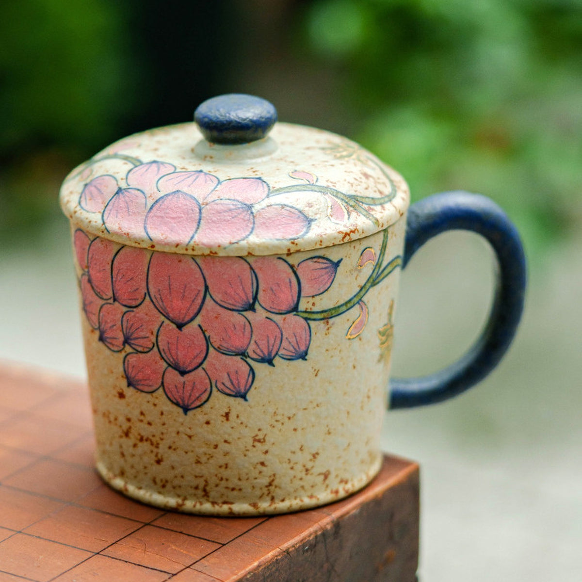 Blue and white gold-trimmed lotus ceramic coffee mug with walnut saucer and porcelain spoon